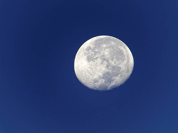 istock Early Morning Full Moon in Clear Blue Sky 534307828