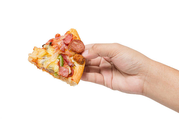 istock hand holding tasty flavorful pizza isolated on white 534309538