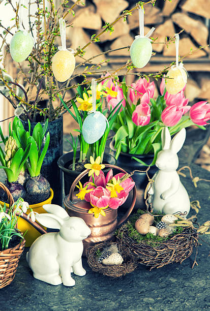 istock Easter bunny and eggs decoration. Spring flowers tulips, narciss 534309539