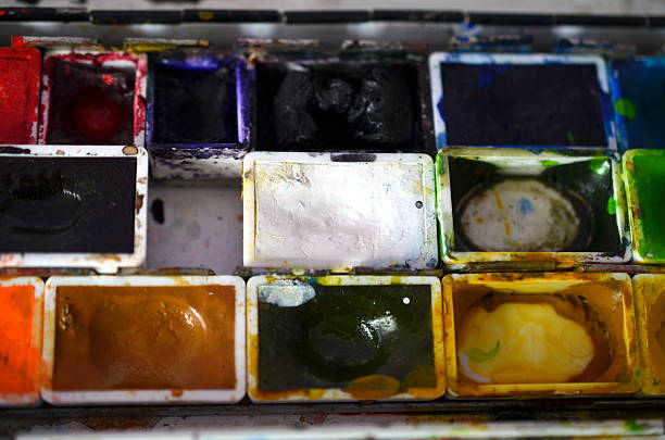istock closup of a messy paintbox after using 534309642