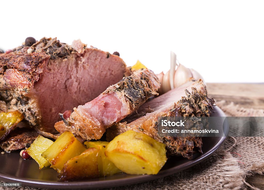 Roasted meat Roasted meat slices on a wooden background 2015 Stock Photo