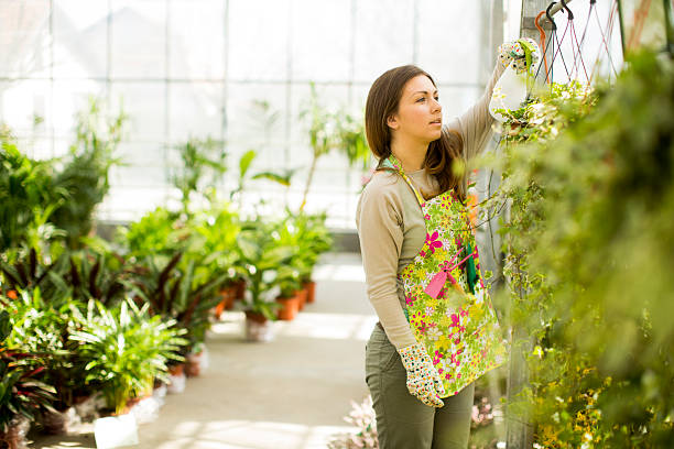 istock Young woman in flower garden 534309919
