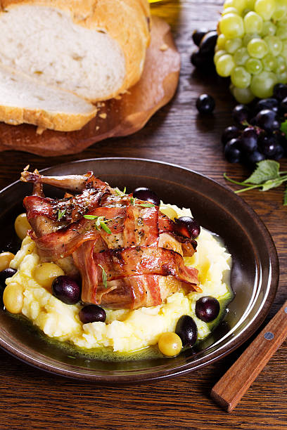 istock Baked stuffed quail with grape sauce. 534310140