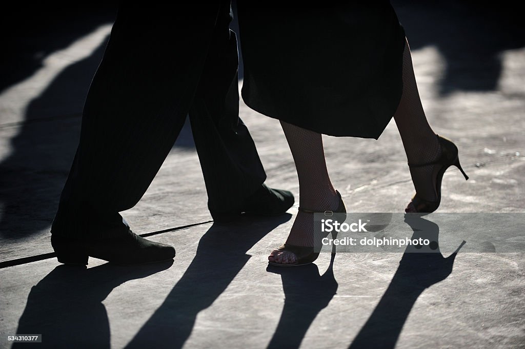 close-up of Tango dancers' foot step in silhouette Tango - Dance Stock Photo