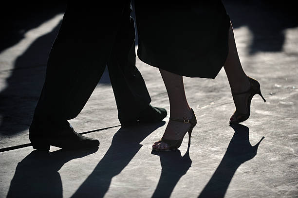 close-up of Tango dancers' foot step in silhouette stock photo
