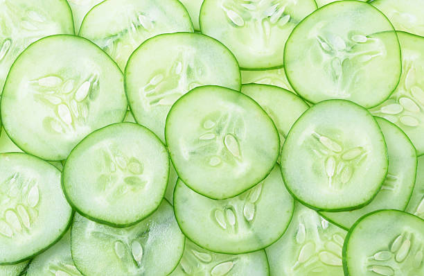 istock Cucumber and slices on  background. 534311349