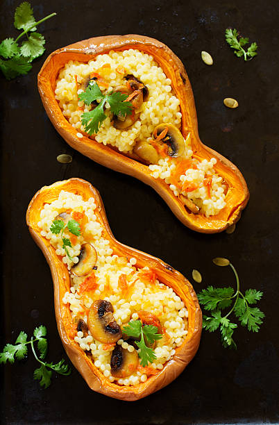 istock Pumpkin stuffed with couscous with grilled mushrooms. 534311644