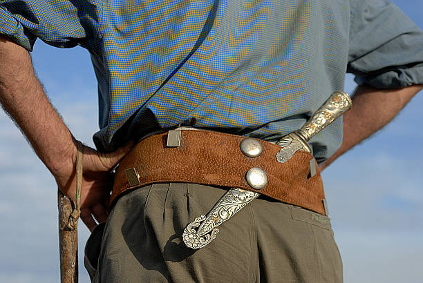 Gaucho, Argentinian cowboy, with silver knife and leather belt Gaucho, Argentinian cowboy, with silver knife and leather belt gaucho stock pictures, royalty-free photos & images