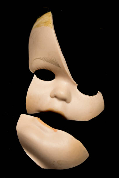 istock Broken Doll Body Parts on Black Background 534311830