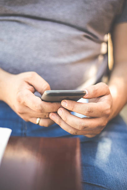 istock Close up of a man using mobile smart phone 534311900
