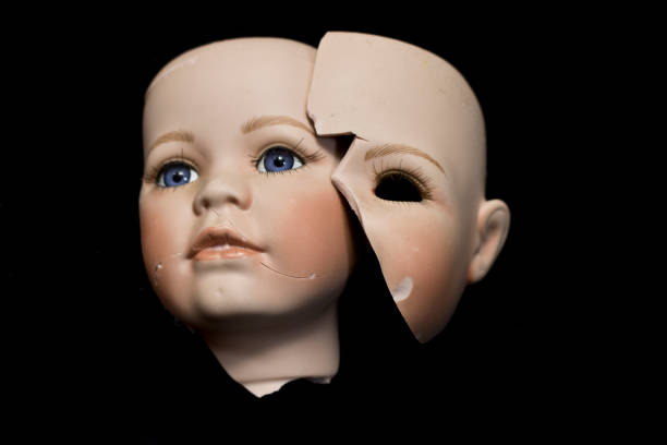 istock Broken Doll Body Parts on Black Background 534312290