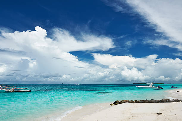 istock Beautiful island beach with motor boat 534313021