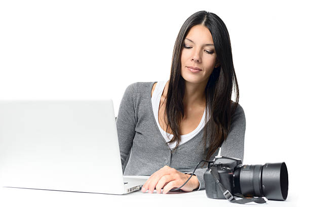 istock Young Woman Connecting Camera to Laptop 534313123