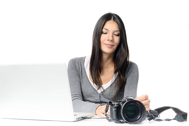 istock Young Woman Connecting Camera to Laptop 534313137