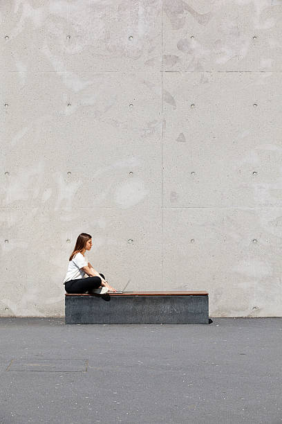 istock girl, laptop, concrete 534314080