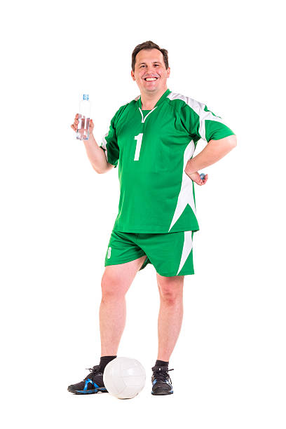 istock Mature man dressed in green sportswear posing 534314458