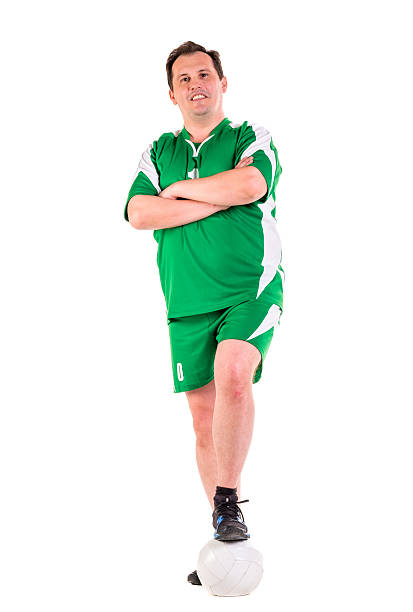 istock Mature man dressed in green sportswear posing 534314610