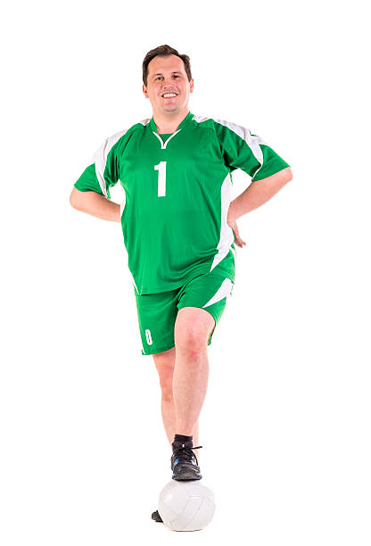 istock Mature man dressed in green sportswear posing 534314622