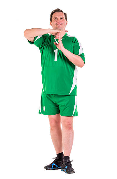 istock Mature man dressed in green sportswear posing 534314828