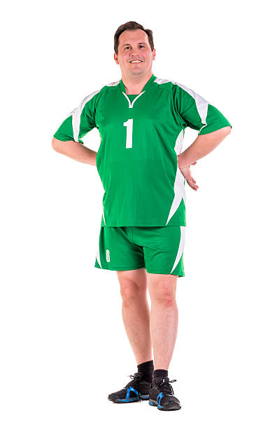 istock Mature man dressed in green sportswear posing 534314856