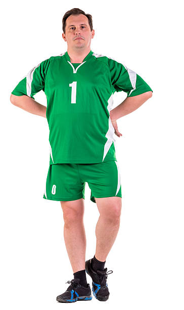 istock Mature man dressed in green sportswear posing 534314924