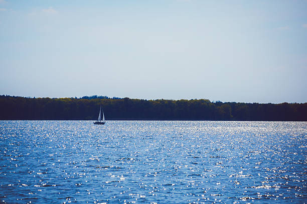 istock sailing motor boat on azure lake 534317368