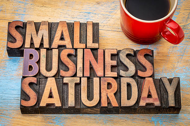 Small Business Saturday in wood type Small Business Saturday word abstract - text in vintage letterpress wood type with a cup of coffee, holiday shopping concept small business saturday stock pictures, royalty-free photos & images