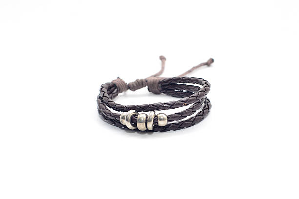 istock closeup men's leather bracelet on white background 534320976