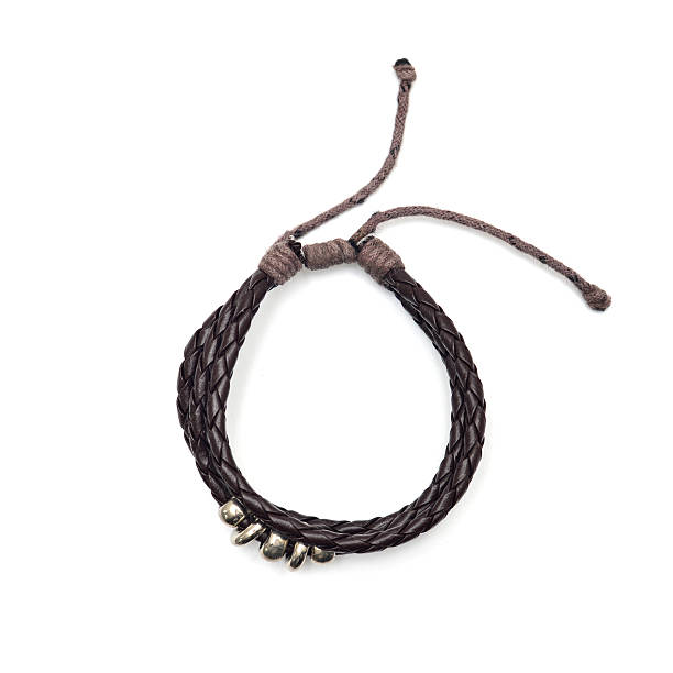 istock closeup men's leather bracelet on white background 534321152
