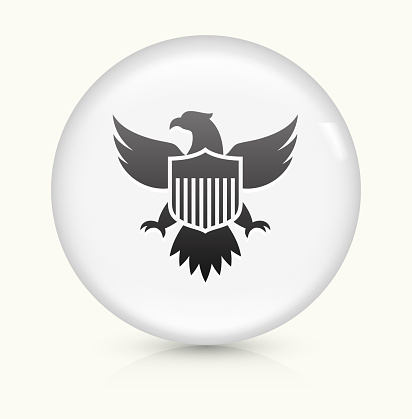 American Eagle and Shield Icon on simple white round button. This 100% royalty free vector button is circular in shape and the icon is the primary subject of the composition. There is a slight reflection visible at the bottom.