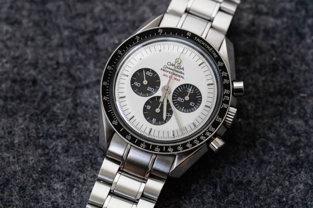 Omega Speedmaster Professional Apollo XI Watch Rare White Panda Dial Stuttgart, Germany - May 26, 2016: Omega Speedmaster Professional Apollo XI 35th Anniversary Chronograph with rare White Dial, black bezel and steel bracelet. The Speedmaster Apollo XI 35th Anniversary: Ref. SU 145.0227 is a very rare one, with its white ‘Panda’ Dial – a white face with black sub-counters. Under the mention Professional at 12 is written in red “July 20, 1969”. swiss watches stock pictures, royalty-free photos & images