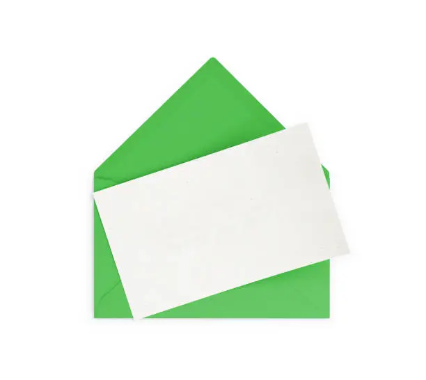 Green  envelope and empty note. Isolated on white background. Clipping path is included.