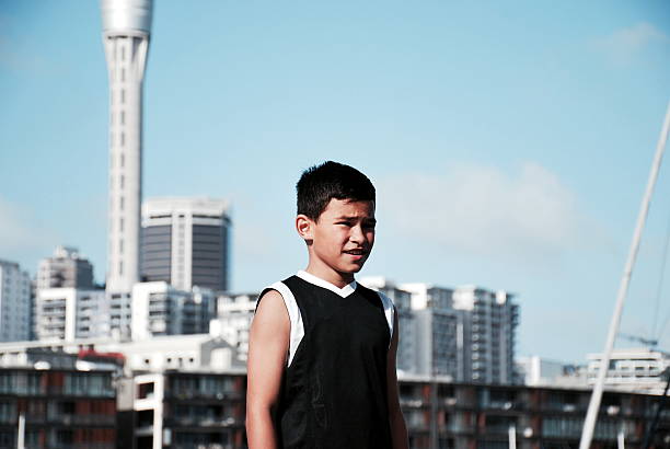 A Pacific Island Boy with an Auckland Cityscape Background.
