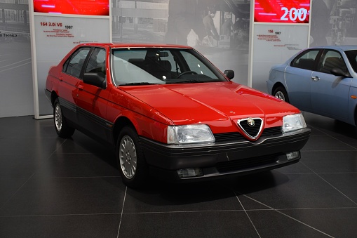 Milan, Italy - February 24th, 2016: The presentation of Alfa Romeo 164 in the car showroom. The 164 model was the most luxury Alfa Romeo vehicle in 80s and 90s.