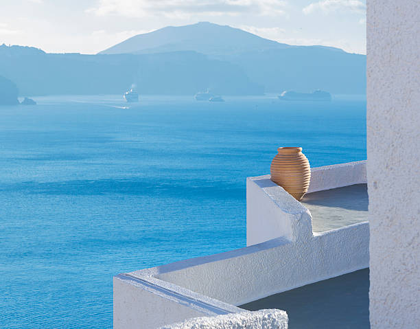 Santorini terrace with amphore in Oia Greece