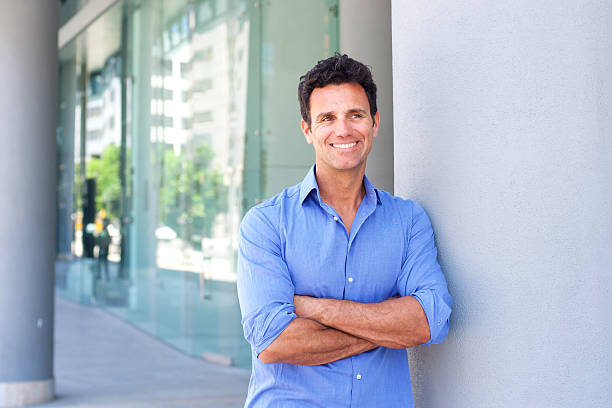 istock Attractive business man smiling with arms crossed 534329906