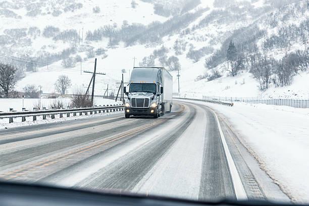 istock Semi Trailer Truck Passing On Slippery Winter Highway 534330086