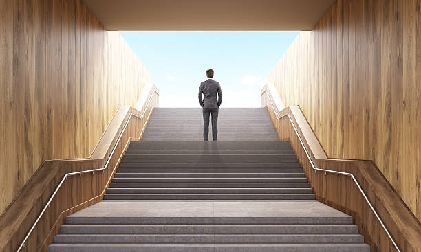 istock Businessman climbing stairs 534331348