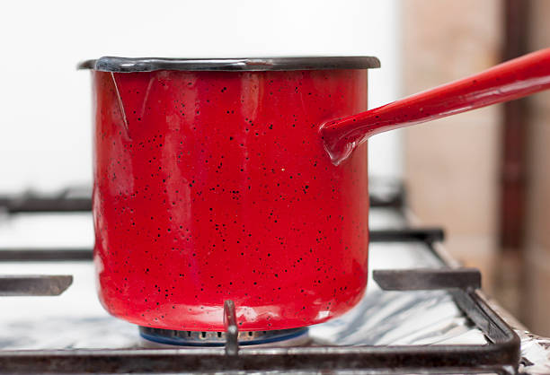 istock Red Pot on Cooker Stove 534332438