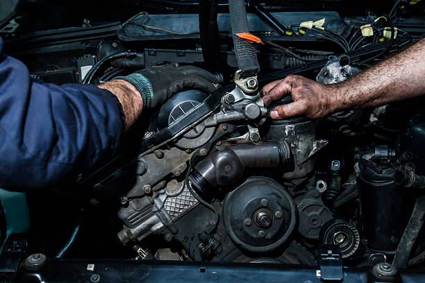 cooperation on repairing motors stock photo