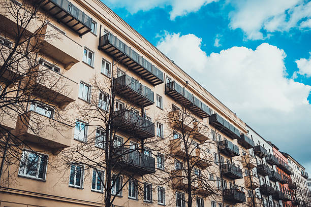 istock orange apartment house with green balcony 534334220