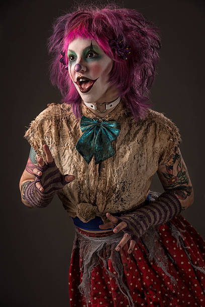 istock Creepy Female Clown on gray 534335486