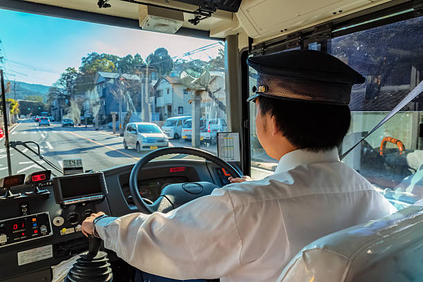Japanese bus driver Mie, Japan - November 20 2015: A Japanese bus driver's on the way to Ise-jingu shrine in Ise city mie prefecture photos stock pictures, royalty-free photos & images