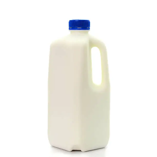 Photo of Milk Bottle with blud Cap Isolated on White Background