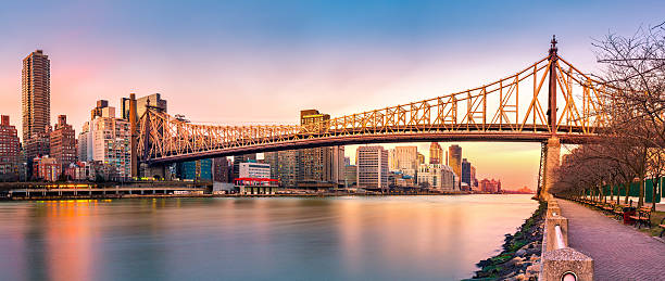 Queensboro bridge panorama at sunset (Ed Koch) Queensboro bridge panorama at sunset, as viewed from Roosevelt Island roosevelt island stock pictures, royalty-free photos & images
