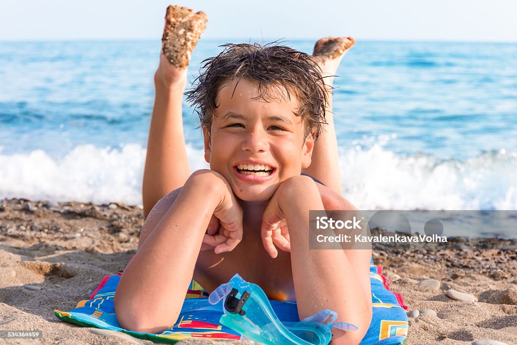 Happy young diver on the sea beach happy laughing boy of twelve with a scuba mask on the sea beachhappy laughing boy of twelve on the sea beach Beach Stock Photo