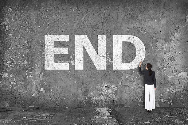 istock businesswoman drawing end on wall 534366009
