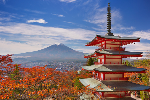 Fujiyoshida, Japan - October 30, 2014: The Chureito pagoda overlooking the city of Fujiyoshida and Mount Fuji in the background. The Chureito pagoda is part of the Arakura Sengen Shrine.