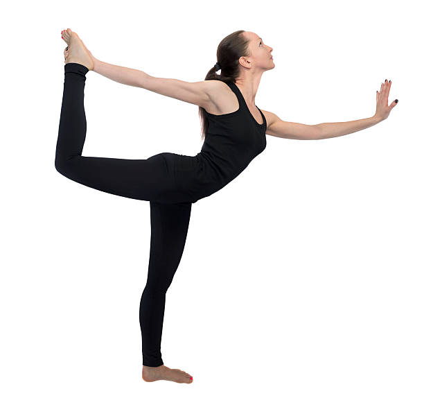 istock Young girl practicing yoga lord of dance pose 534368201