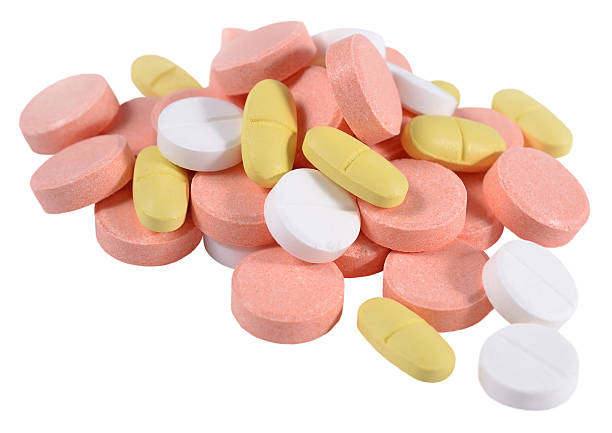 istock Heap of colorful pills on a white 534368241